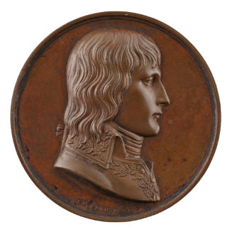 Silver medal of a man in profile to the right wearing a silk cravat and a military jacket, the …