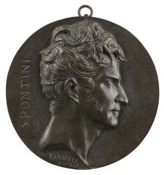 Bronze medal of a man in profile to the right