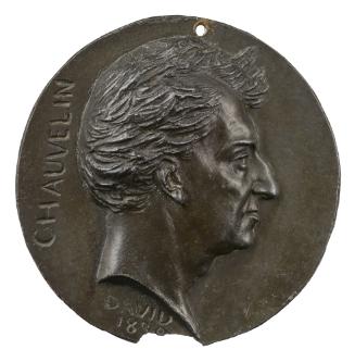 Bronze medal of a man in profile to the right