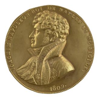 Gilt bronze medal of a man in profile to the left wearing a cravat, a sash, and a high-collared…