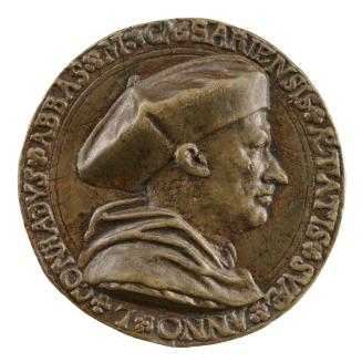 Bronze medal of a man in profile to the right