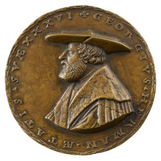 Bronze medal of a man wearing a wide-brimmed hat and a fur-collared mantel