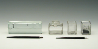 Glass inkwells, box, and nib pens