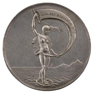 Silver medal depicting a female figure standing with a sail on a wheel in the sea