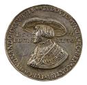 Silver medal of a man wearing a large-rimmed hat, a pleated chemise with embroidered collar, a …