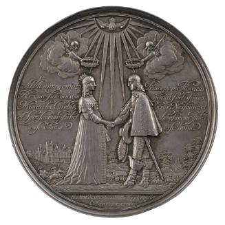 Silver medal of a man and woman joining hands and receiving laurel wreaths from angels above