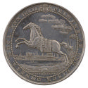 Silver medal depicting a horse moving to left in front of a cityscape with a setting sun