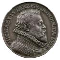 Silver medal of a man with mid length hair and a beard, wearing armor and a high ruff collar