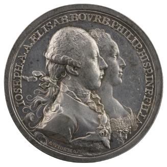 Silver medal of a man and woman in profile to the right