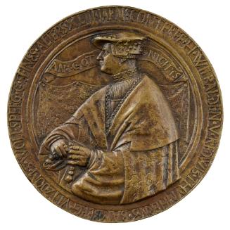 Bronze medal of a man wearing a hat, a pleated shirt, a rich cape, and a chain and holding a ro…