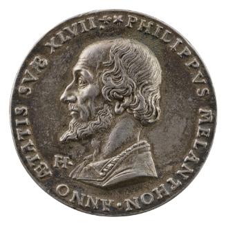 Silver medal of a man in profile to the left