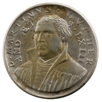 Silver medal of a man wearing an academic gown