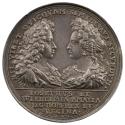 Silver medal depicting the emperor and princess facing each other, the emperor wearing the badg…