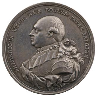 Silver medal of a man in profile to the left