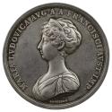 Silver medal of a woman in profile to the left wearing a diadem and tunic dress