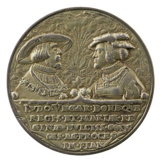 Silver medal of a woman and men facing each other in profile