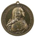 Gilt silver medal of a man in profile to the right