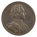 Silver medal of a man wearing a harness with a draped mantle