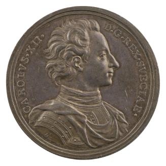 Silver medal of a man wearing a harness with a draped mantle