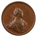 Bronze medal of a woman with an imperial crown on her head and hair tied with a ribbon around h…