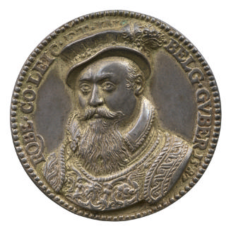 Silver medal of a man in a flat collar and richly decorated armor, wearing a soft cap with a be…