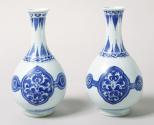 Pair of blue and white porcelain bottle shaped vases.