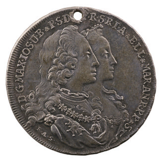 Silver medal of a man and woman both in profile to the right