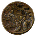 Bronze medal of the nativity with Mary and Joseph kneeling over the baby Jesus, with a camel in…