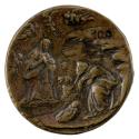 Bronze medal of the nativity with Mary and Joseph kneeling over the baby Jesus, with a camel in…