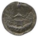 Lead medal of an open hexagonal box with a ring inside in a rocky landscape with a radiant sun …