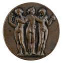 Bronze medal of three nude women, their arms around each other’s shoulders, the central woman t…