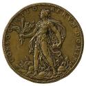 Bronze medal of a woman wearing a long loose transparent gown and cape, walking in profile to t…