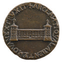 Bronze medal of a long three story building with towers on either end