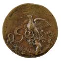 Bronze medal of an eagle in a tree, with a ribbon in its claws, curling out to either side