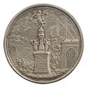 Silver medal of a statue of a trumpeting angel standing on a plinth, with four figures standing…