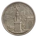 Silver medal of a statue of a trumpeting angel standing on a plinth, with four figures standing…