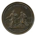 Bronze medal of two men, the one on the left bearded and wearing a triangular hat, the one on t…