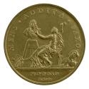 Gilt bronze medal depicting a woman in classical dress and drapery, seated, raising a hammer to…