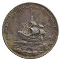 Silver medal of a war galleon, square sails full, moving away from the shore