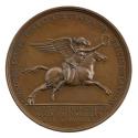 Bronze medal of a winged woman in a sheer, classical dress, riding a barebacked, leaping horse …