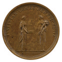 Bronze medal of two female figures personifying Justice and Plenty. Justice stand on the left a…