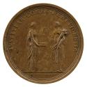 Bronze medal of two female figures personifying Justice and Plenty. Justice stand on the left a…