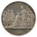 Silver medal depicting a man wearing a coronation robe kneeling before a Bishop who anoints him