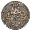 Silver medal depicting a helmet with shield
