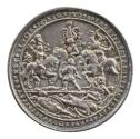 Silver medal depicting a tournament scene with three mounted knights in armor with crested helm…