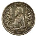 Silver medal of Ferdinand I wearing full armor holding a scroll