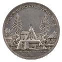 Silver medal depicting a large mining area with cornucopia spilling out ingots and coins on eit…