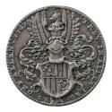 Silver medal depicting a plumed helmet above a shield