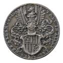 Silver medal depicting a plumed helmet above a shield