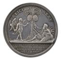 Silver medal of a palm tree with a striding man on the left and a reclining god on the right